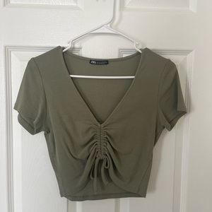 green crop top with adjustable string in the middle
